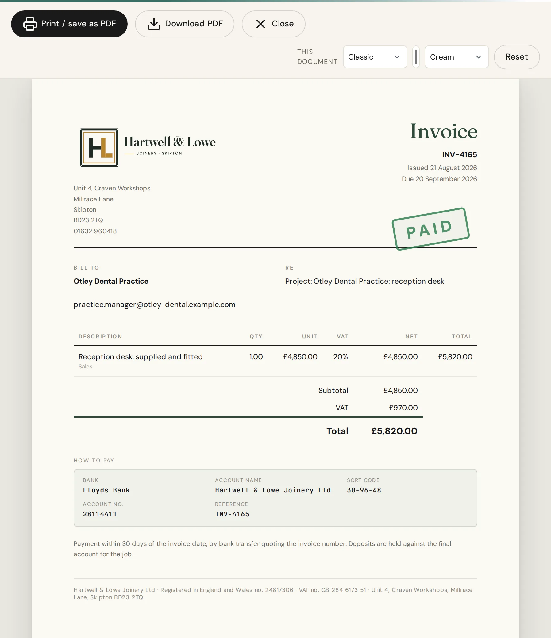 An IQ Books invoice in the Classic design with a PAID stamp, which is the receipt